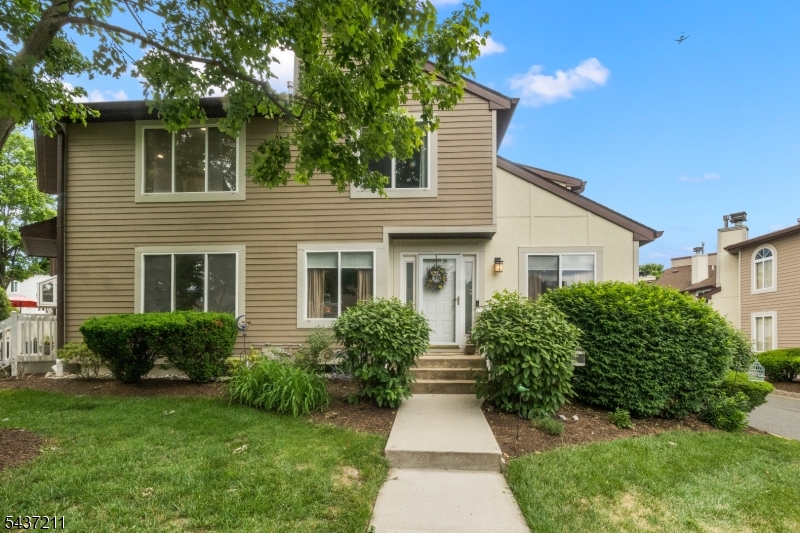 3701 Park Place Springfield, NJ 07081 - Photo 1 of 38 a front view of a house with a yard and potted plants