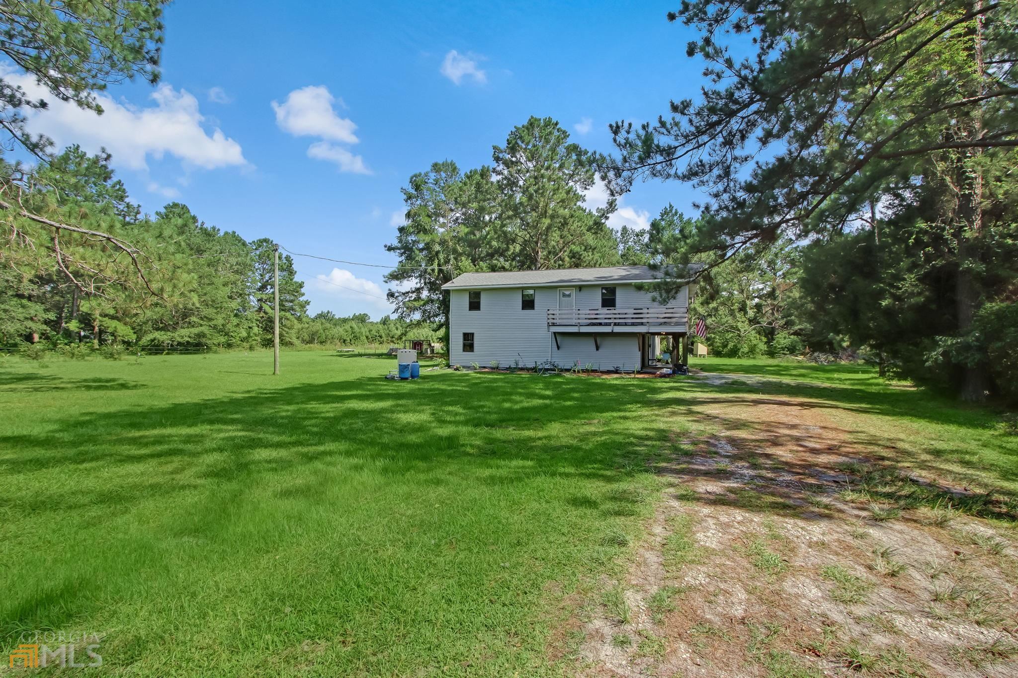 a view of a house with a big yard