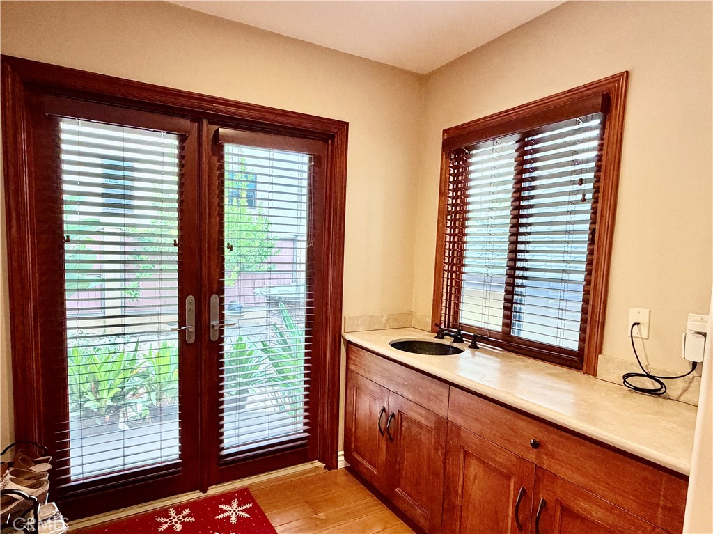 116 Termino Avenue Long Beach, CA 90803 - Photo 29 of 67 Laundry area with french doors leading to backyard