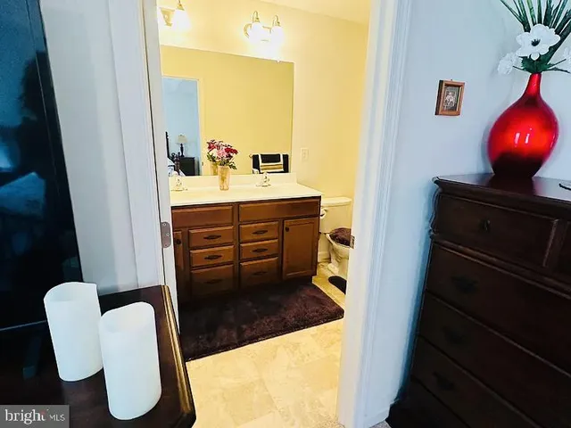 a bathroom with a sink and mirror