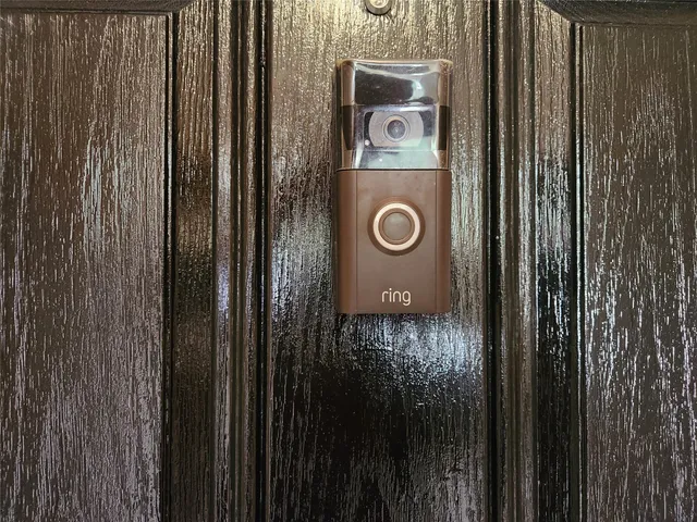 a white toilet sitting next to a white cabinet