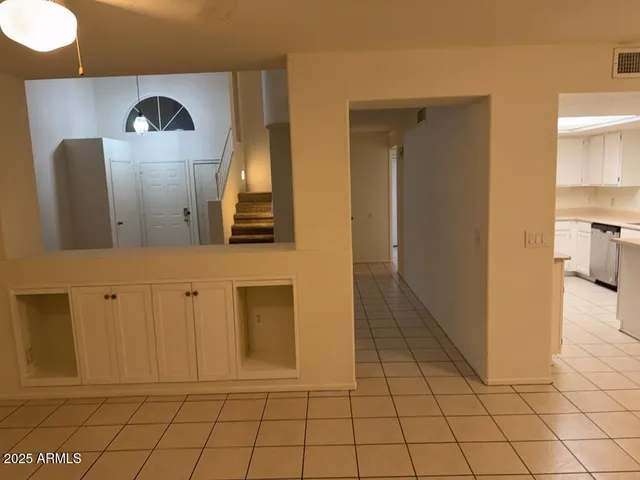 a view of a kitchen with a sink and a refrigerator