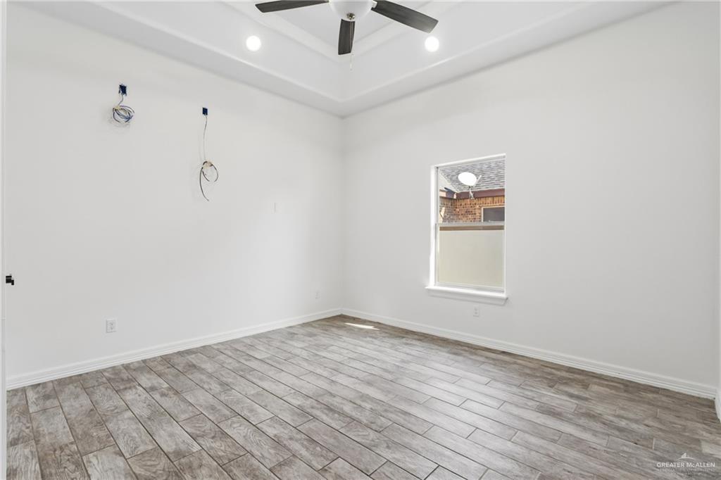 513 Mi Vida Street Weslaco, TX 78596 - Photo 13 of 22 wooden floor in an empty room