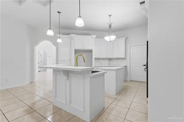 a kitchen with a sink cabinets and window