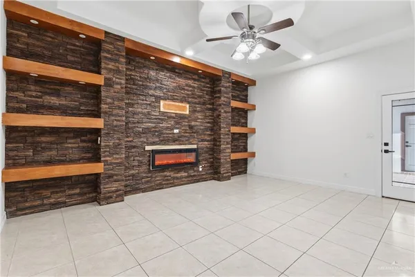 a view of an empty room with a fireplace