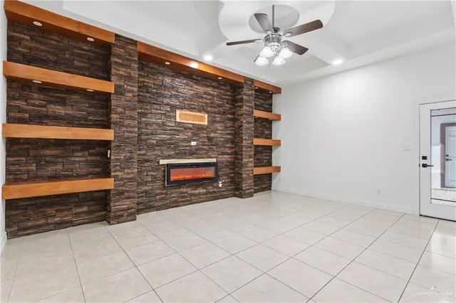 a view of an empty room with a fireplace