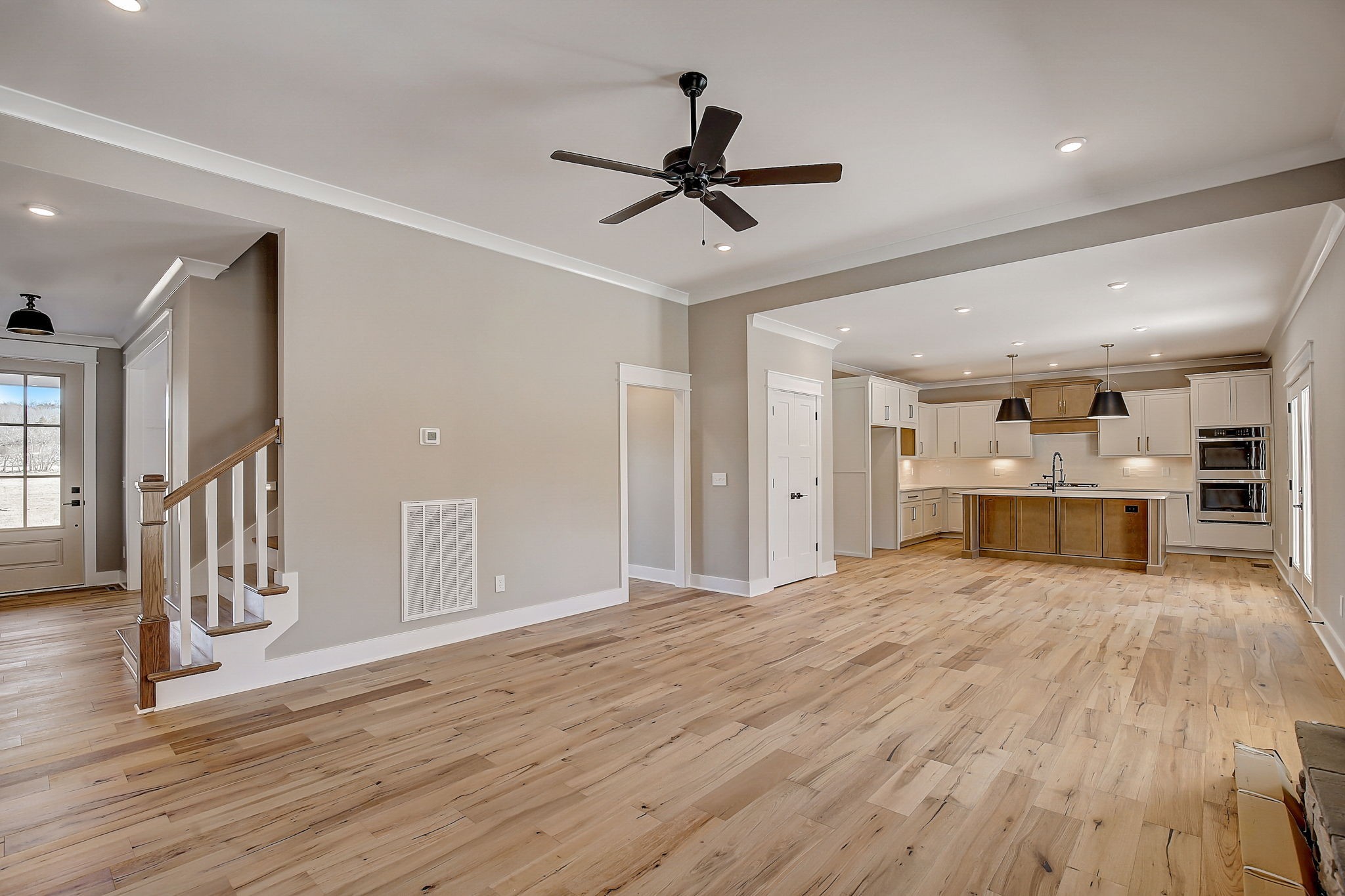 7311 North Milton Road Milton, TN 37118 - Photo 11 of 54 a view of a livingroom with a ceiling fan wooden floor and window