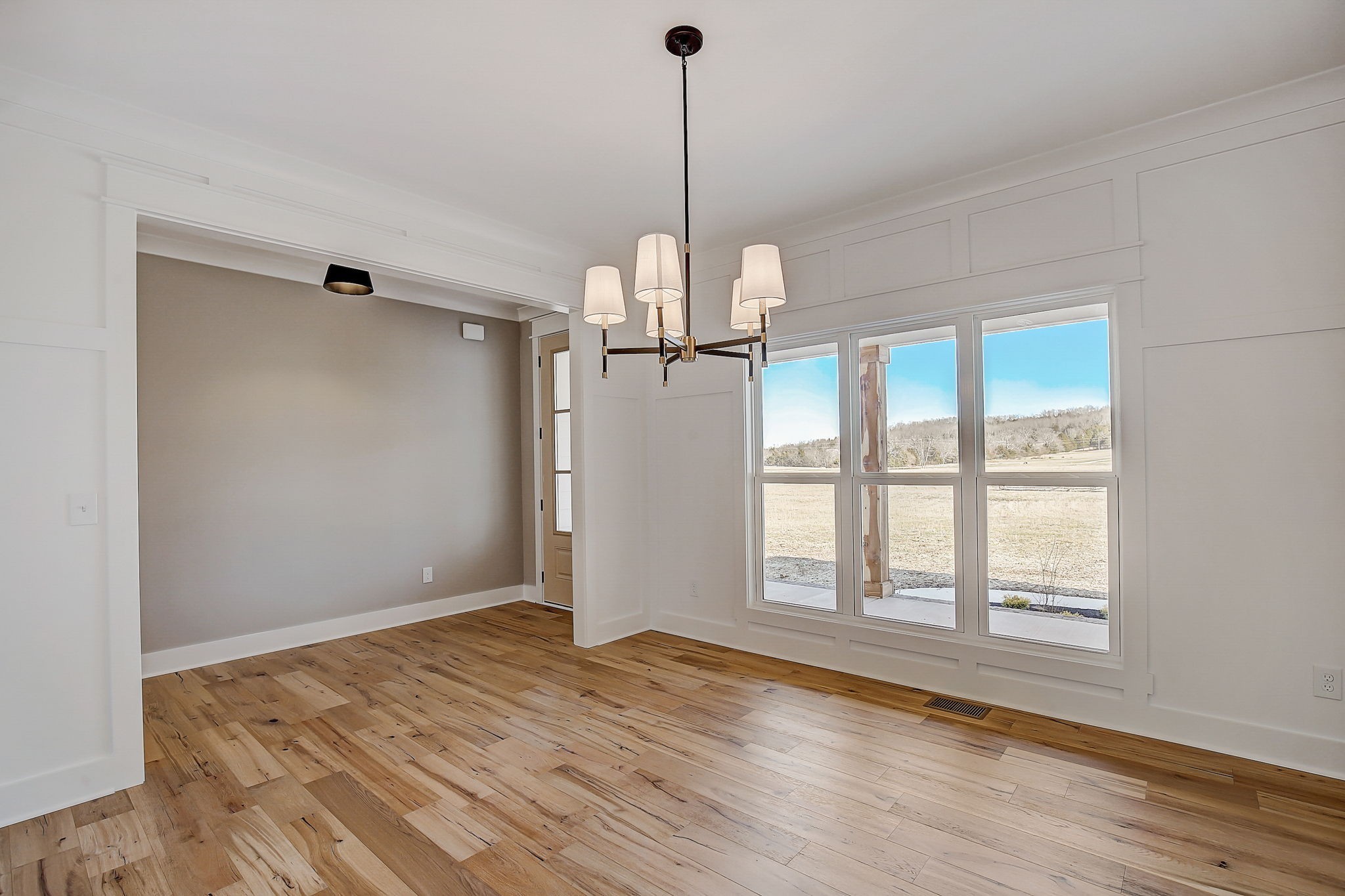 7311 North Milton Road Milton, TN 37118 - Photo 13 of 54 a view of a room with window wooden floor and chandelier