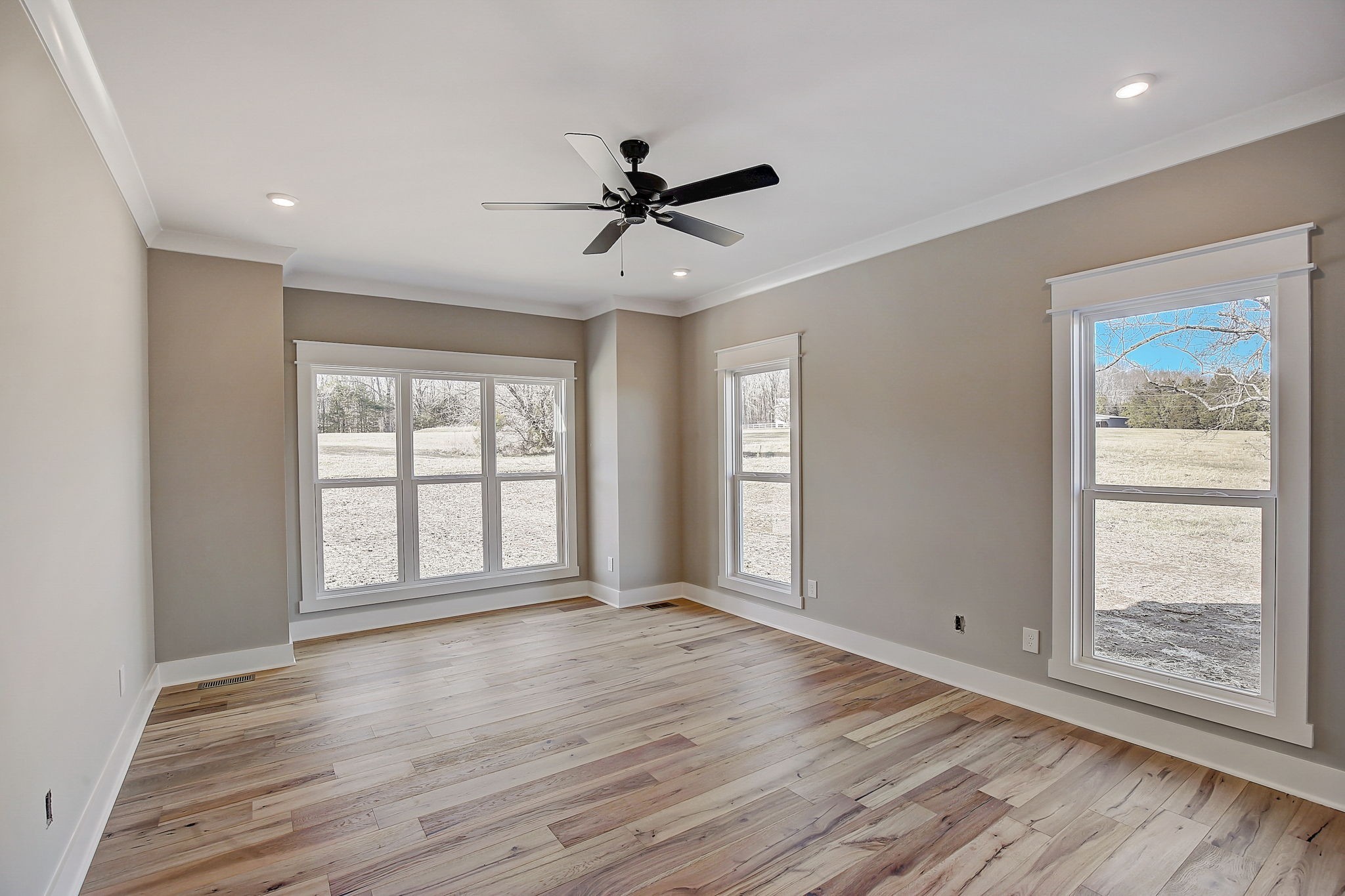 7311 North Milton Road Milton, TN 37118 - Photo 20 of 54 a view of an empty room with wooden floor and a window