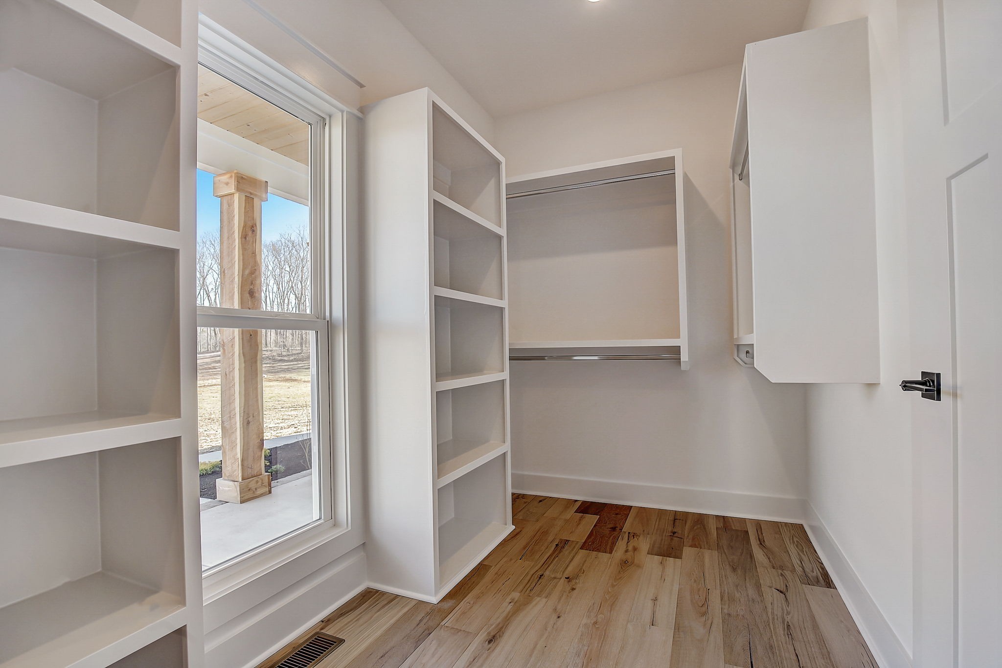 7311 North Milton Road Milton, TN 37118 - Photo 26 of 54 a view of walk in closet with wooden floor