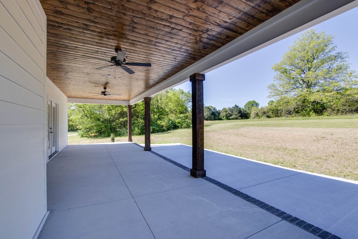 7311 North Milton Road Milton, TN 37118 - Photo 49 of 54 a view of a building hardwood floor and a yard
