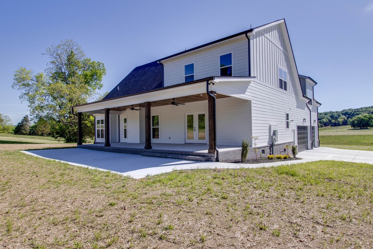 7311 North Milton Road Milton, TN 37118 - Photo 51 of 54 a front view of a house with patio and yard