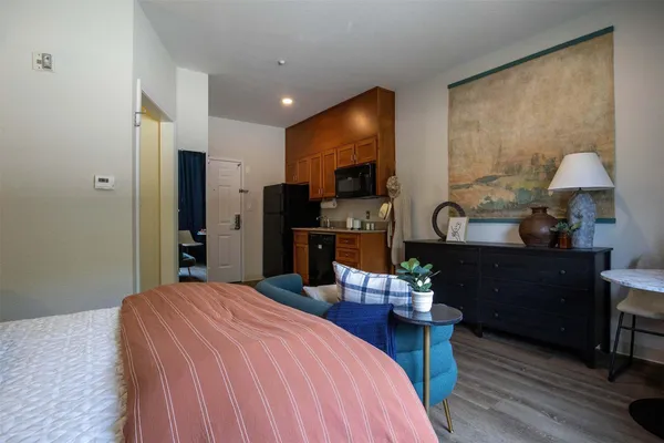 a bedroom with a bed and furniture