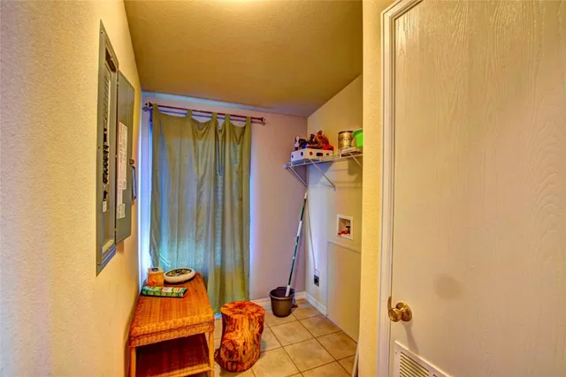 a bathroom with a sink mirror and shower