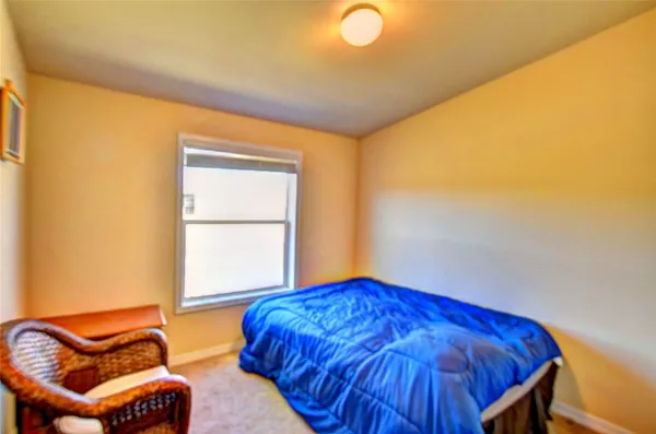 a bedroom with a bed and a closet