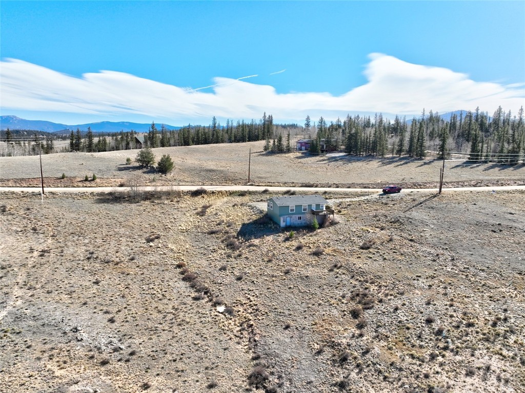 735 Apache Trail Como, CO 80456 - Photo 26 of 37 a view of a dry yard with trees
