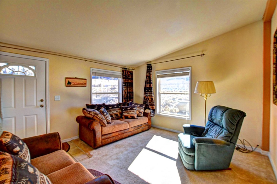 735 Apache Trail Como, CO 80456 - Photo 4 of 37 a living room with furniture and a window