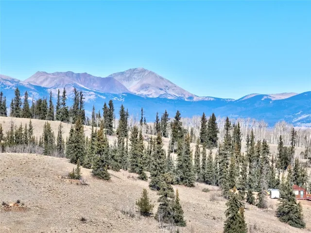 a view of a town with mountains in the background