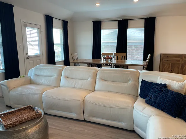 a workspace with furniture and wooden floor