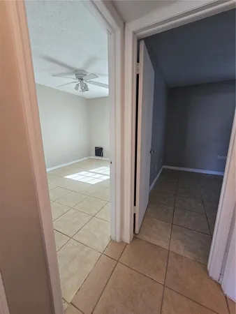 a view of an empty room with a bathroom