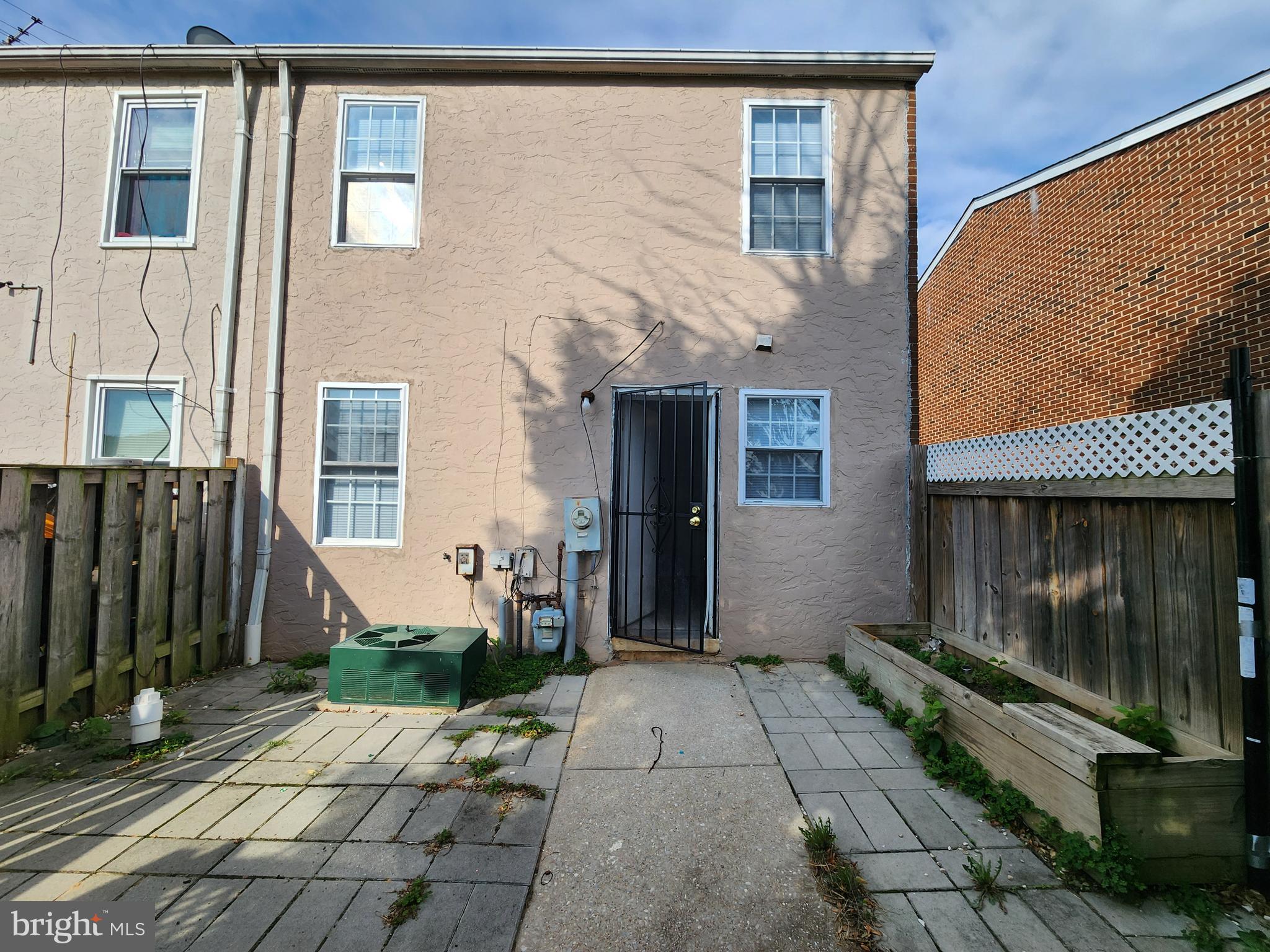 819 Aisquith Street Baltimore, MD 21202 - Photo 22 of 24 a front view of a house with a yard