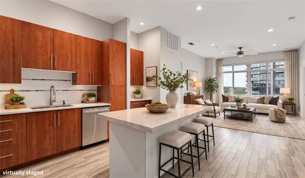 a kitchen with sink cabinets and wooden floor