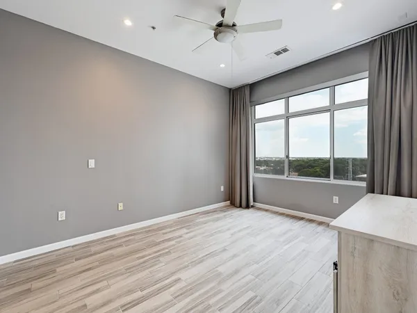 a view of an empty room with a window