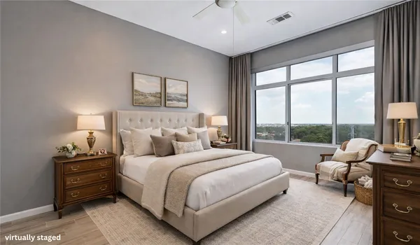 a bedroom with a bed and a couch