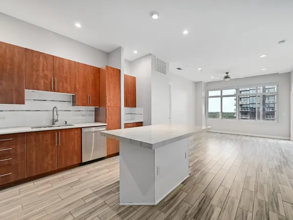 a kitchen with wooden floors and sink