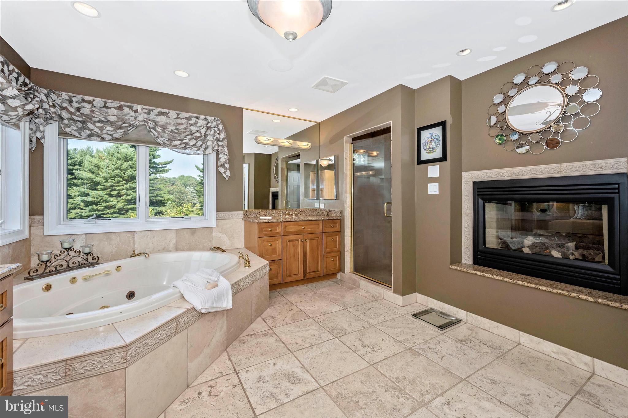 12215 Etchison Road Ellicott City, MD 21042 - Photo 20 of 46 Primary bath, gas 2 sided fireplace