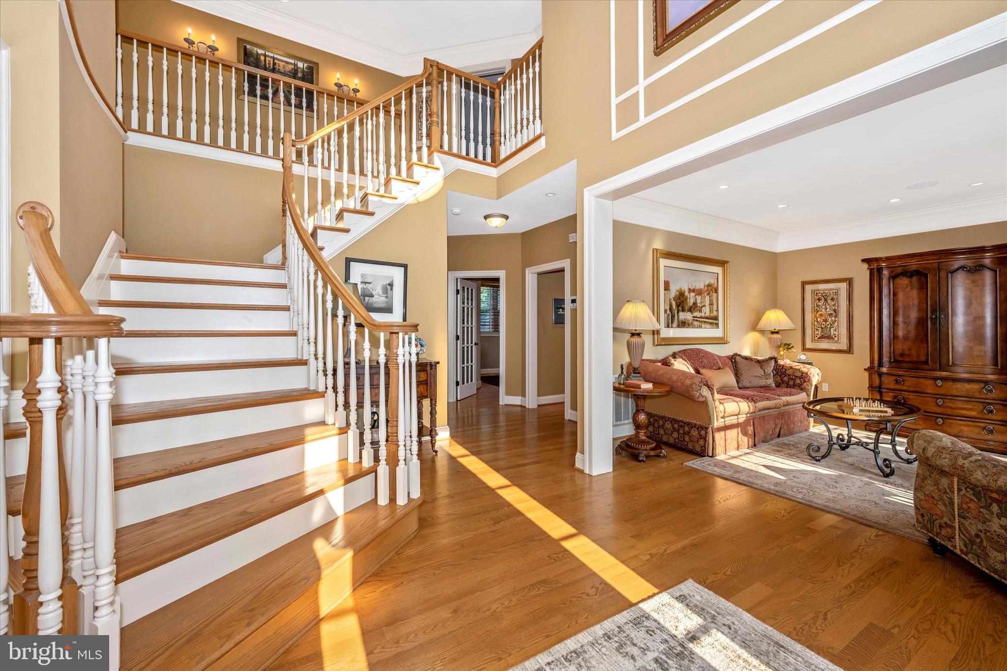 12215 Etchison Road Ellicott City, MD 21042 - Photo 6 of 46 Foyer stairs, 2nd staircase goes to rear of home