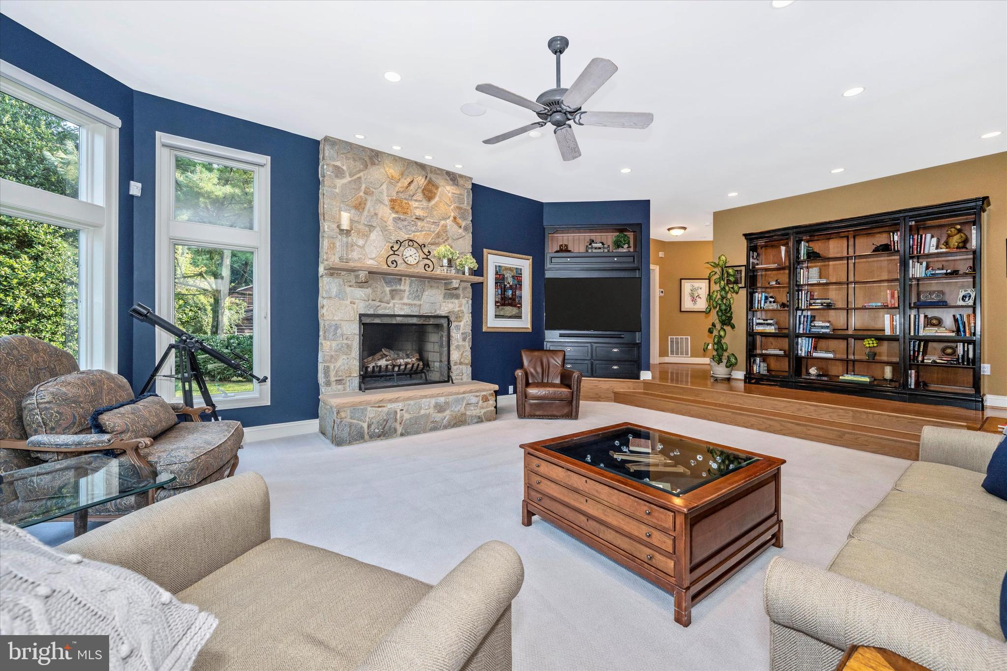 12215 Etchison Road Ellicott City, MD 21042 - Photo 9 of 46 Great room with stone fireplace adjoining kitchen