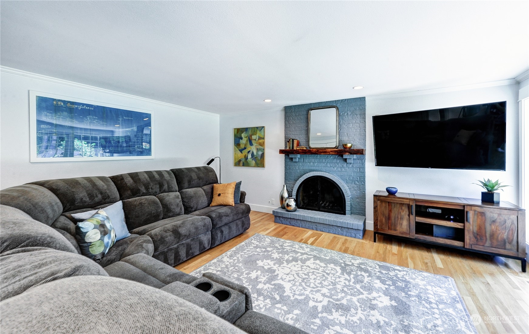 25 Cascade Key Bellevue, WA 98006 - Photo 12 of 33 a living room with furniture a flat screen tv and a fireplace