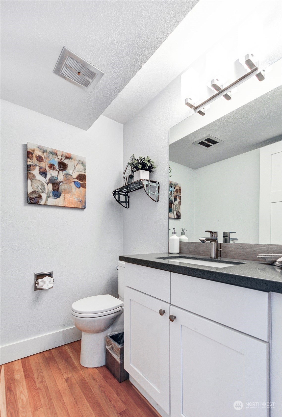 25 Cascade Key Bellevue, WA 98006 - Photo 14 of 33 a bathroom with a toilet a sink and mirror