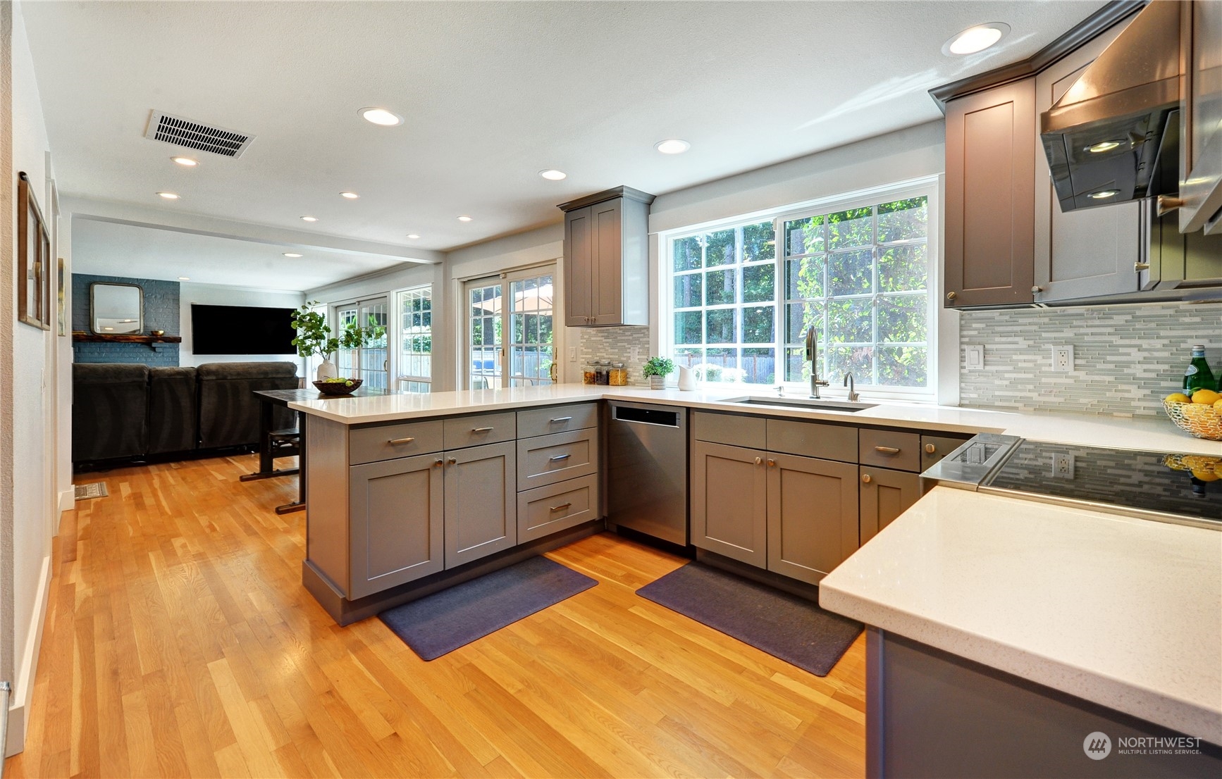 25 Cascade Key Bellevue, WA 98006 - Photo 9 of 33 a kitchen with a sink a counter top space stainless steel appliances and a large window
