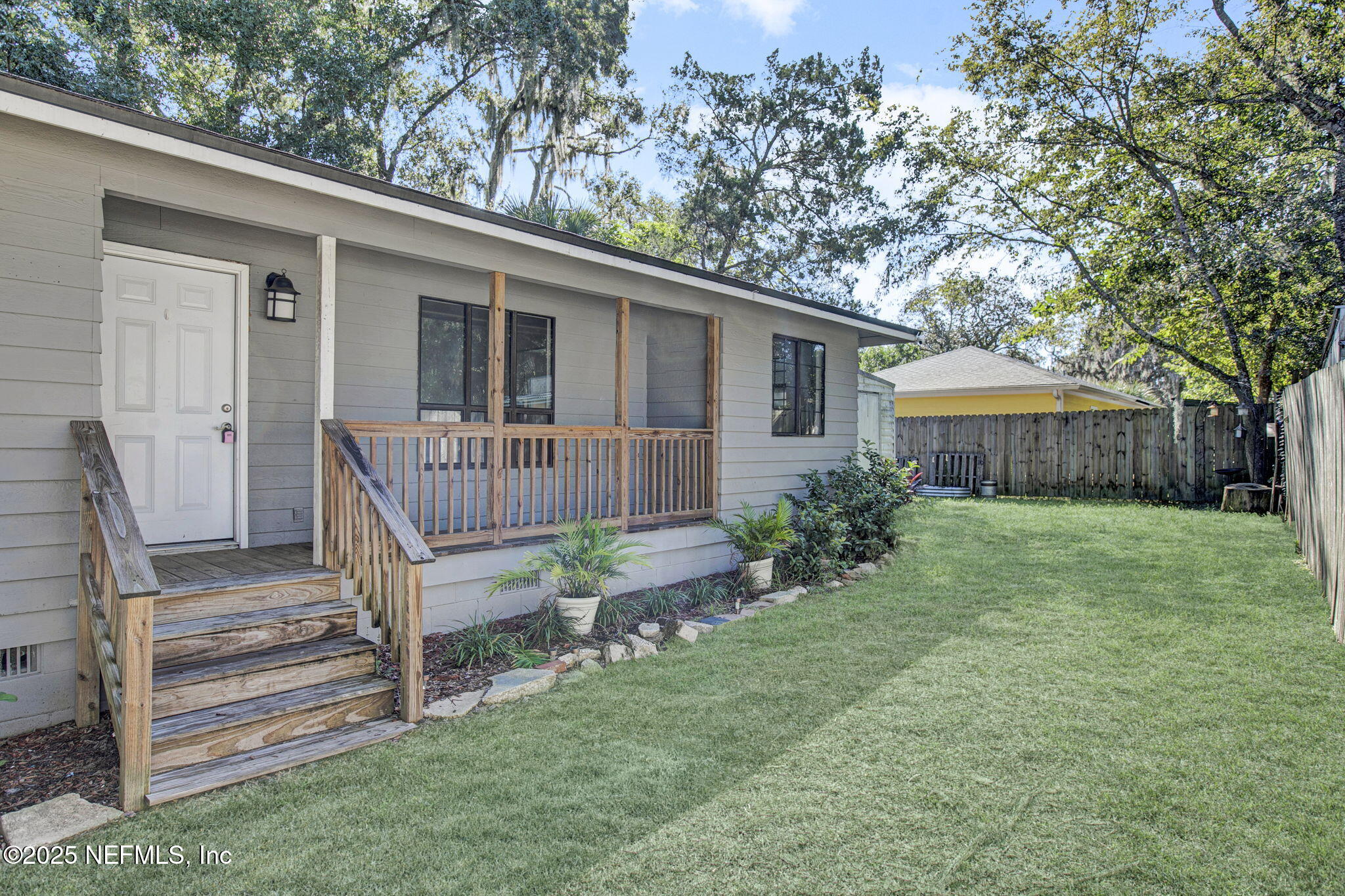 591 Julia Street St. Augustine, FL 32084 - Photo 1 of 19 a front view of a house with a yard