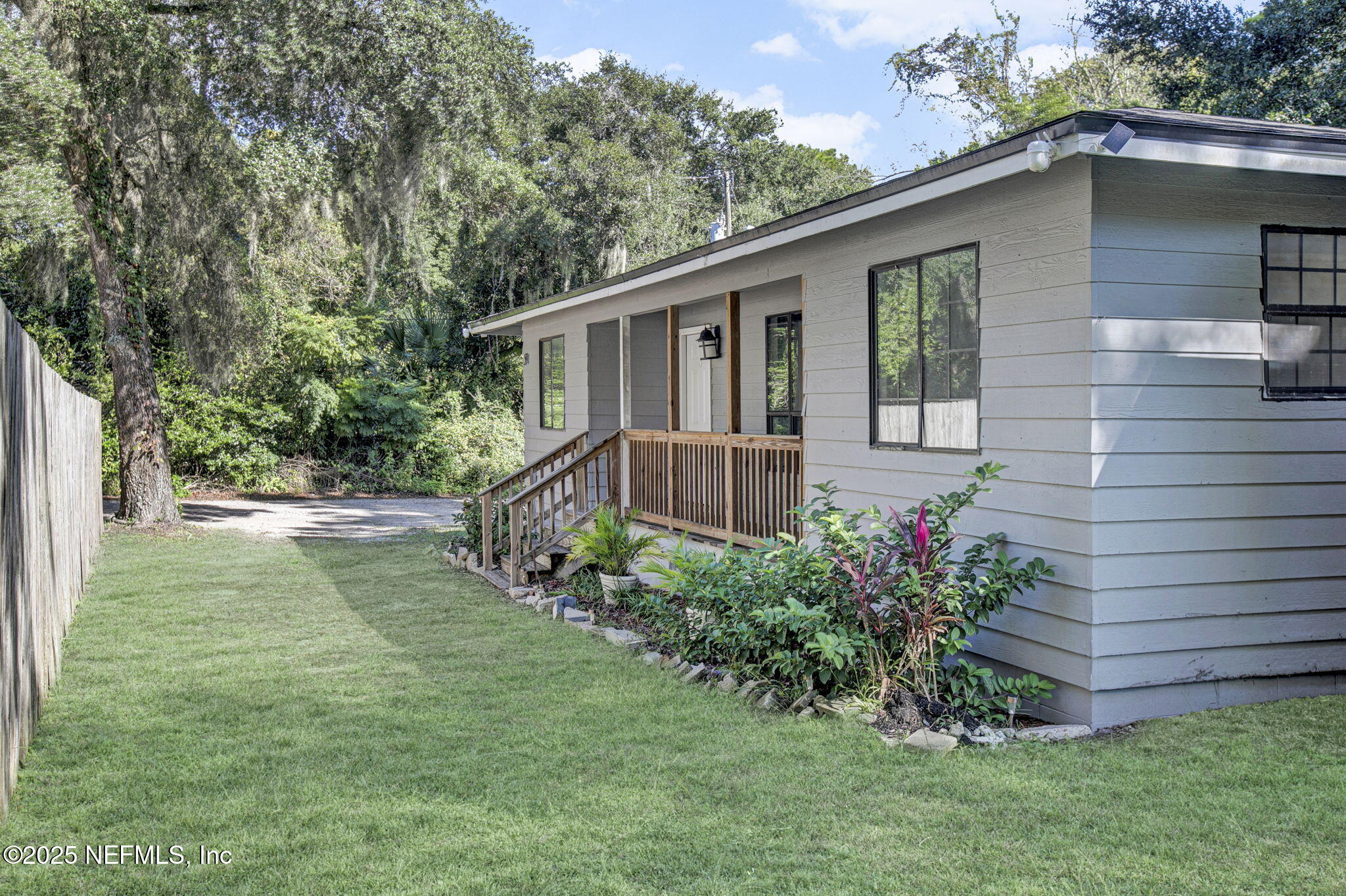591 Julia Street St. Augustine, FL 32084 - Photo 2 of 19 a view of a house with a yard and plants