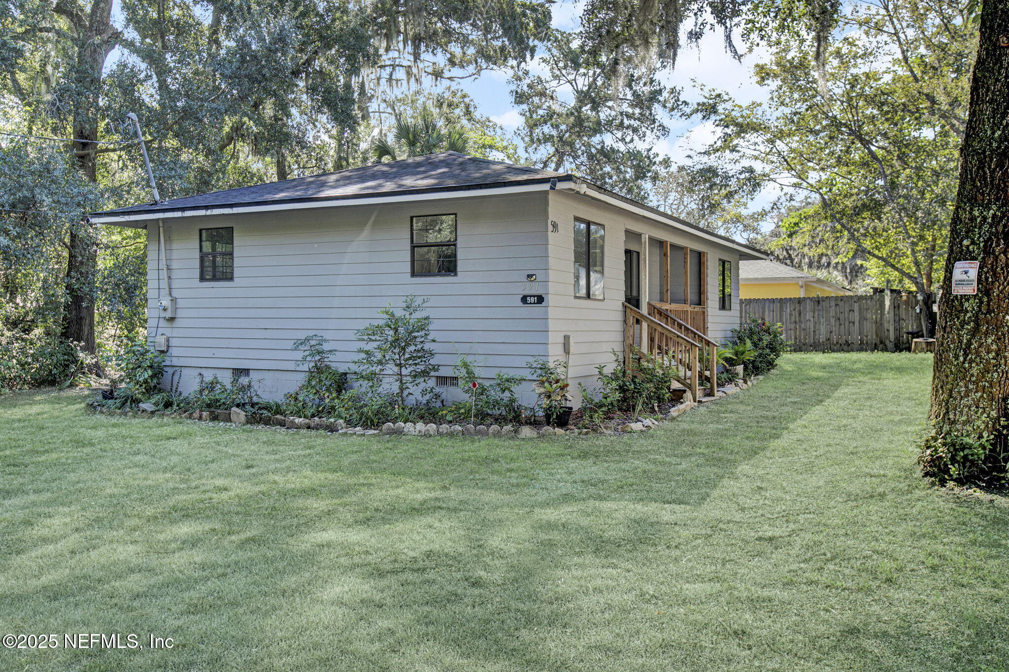 591 Julia Street St. Augustine, FL 32084 - Photo 3 of 19 a front view of a house with a garden