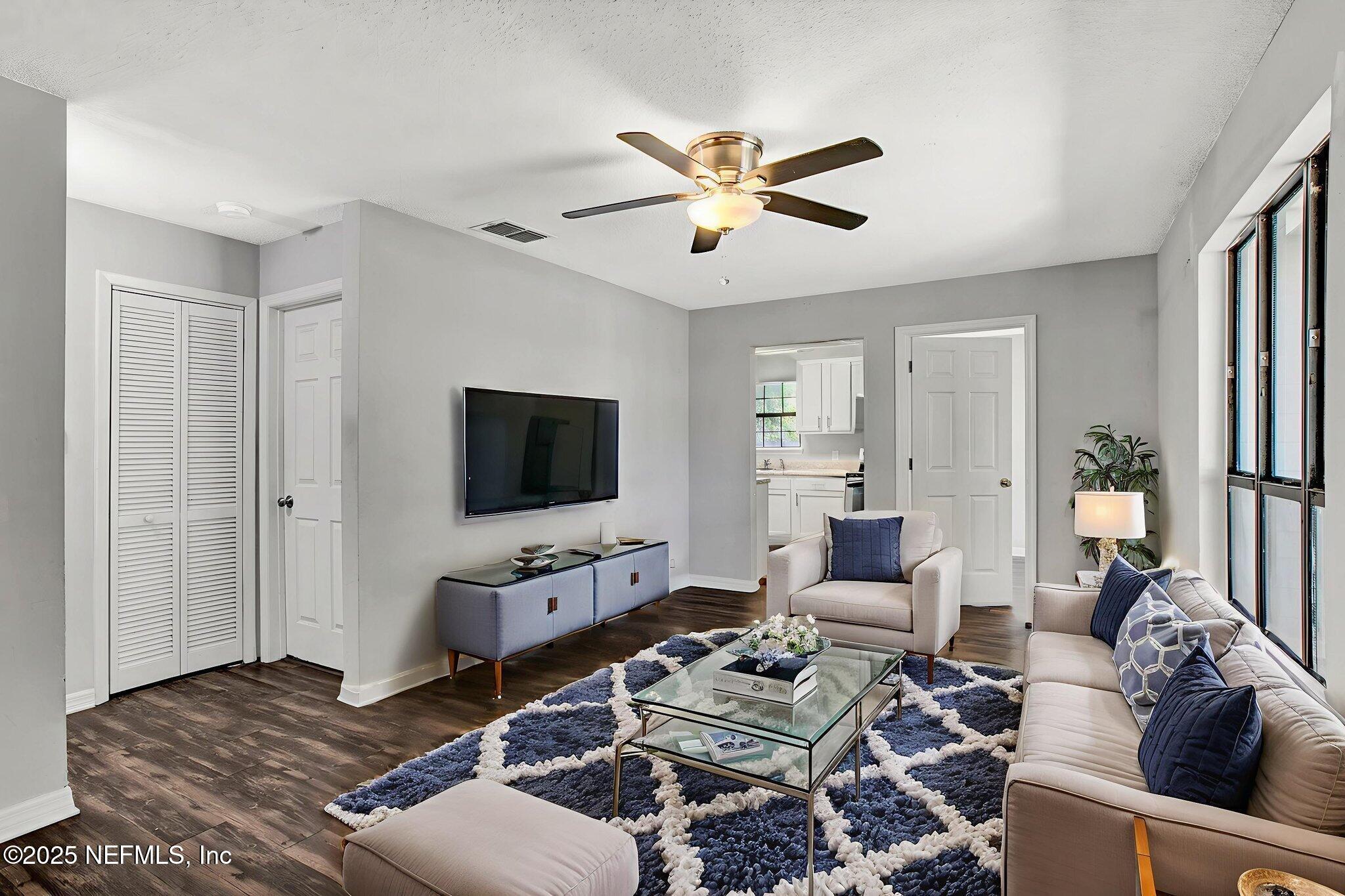 591 Julia Street St. Augustine, FL 32084 - Photo 5 of 19 a living room with furniture a rug and a flat screen tv