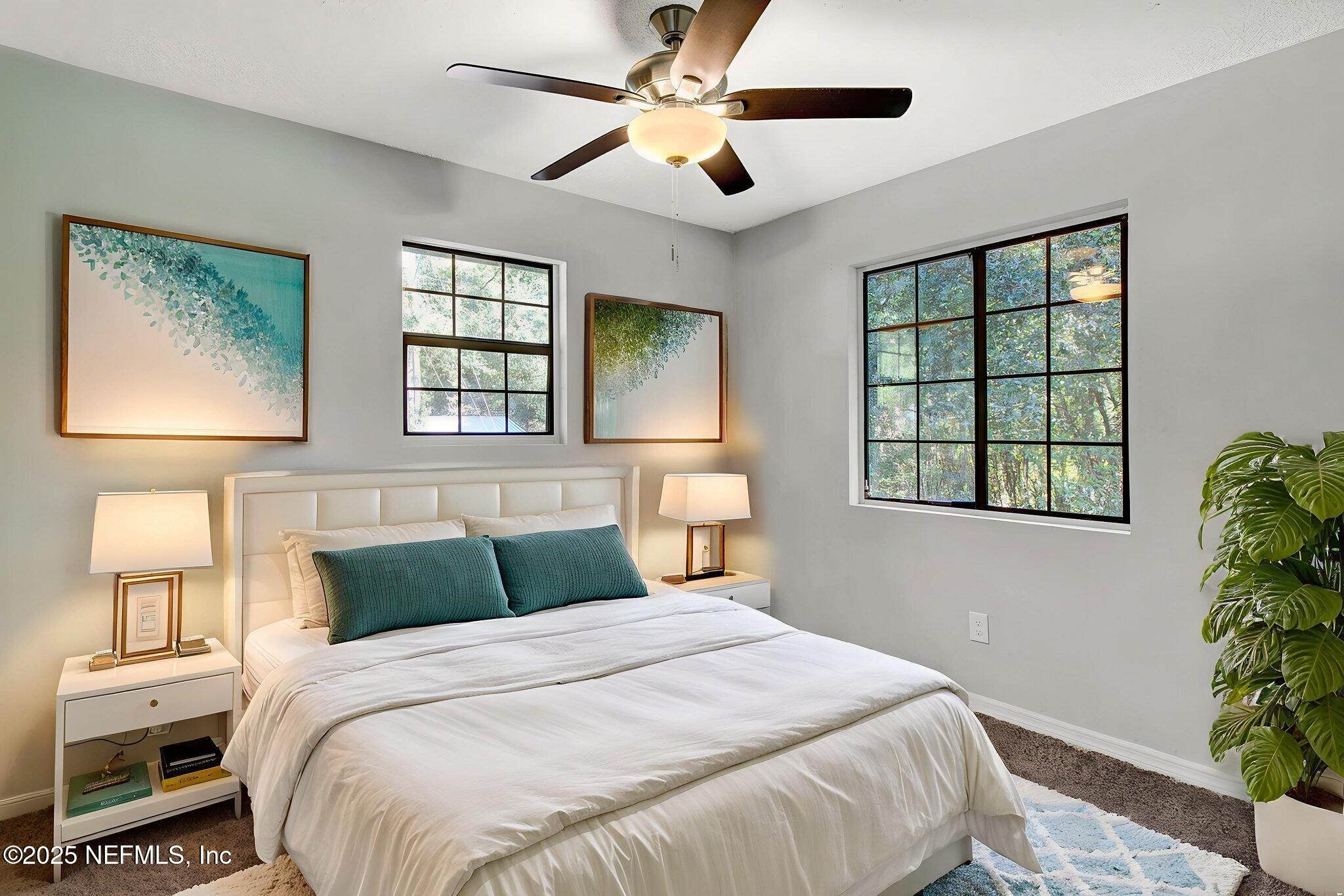 591 Julia Street St. Augustine, FL 32084 - Photo 7 of 19 a bedroom with a large bed and a window