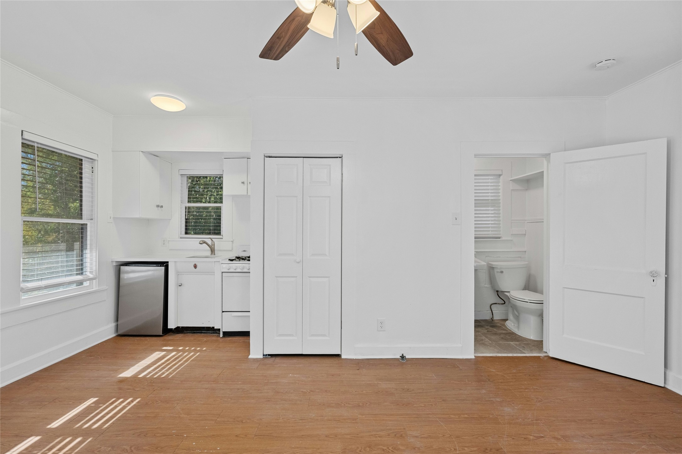 2201 Leon Street, Unit G Austin, TX 78705 - Photo 4 of 17 Open-concept living space with wood-finish flooring