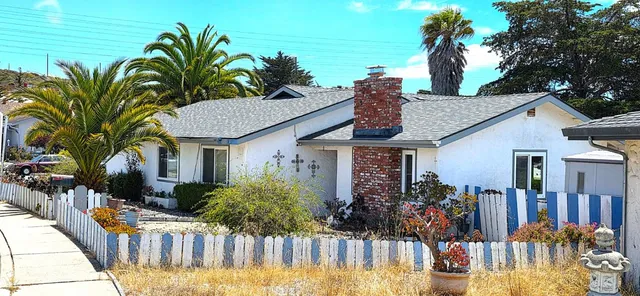 a front view of house and yard with seating space