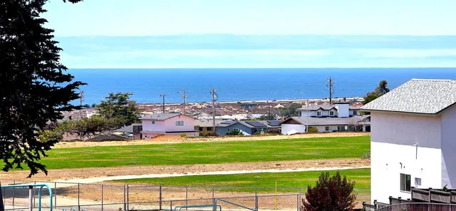 a aerial view of a house with a yard