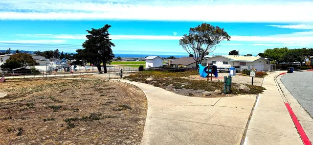 a view of a house with a wooden fence