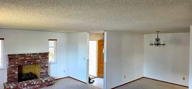 an entryway with a chandelier
