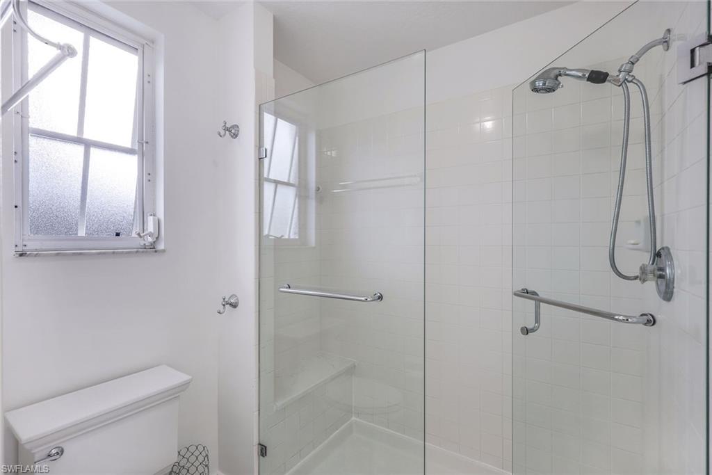 7108 Barrington Circle Naples, FL 34108 - Photo 16 of 25 a bathroom with a shower and toilet