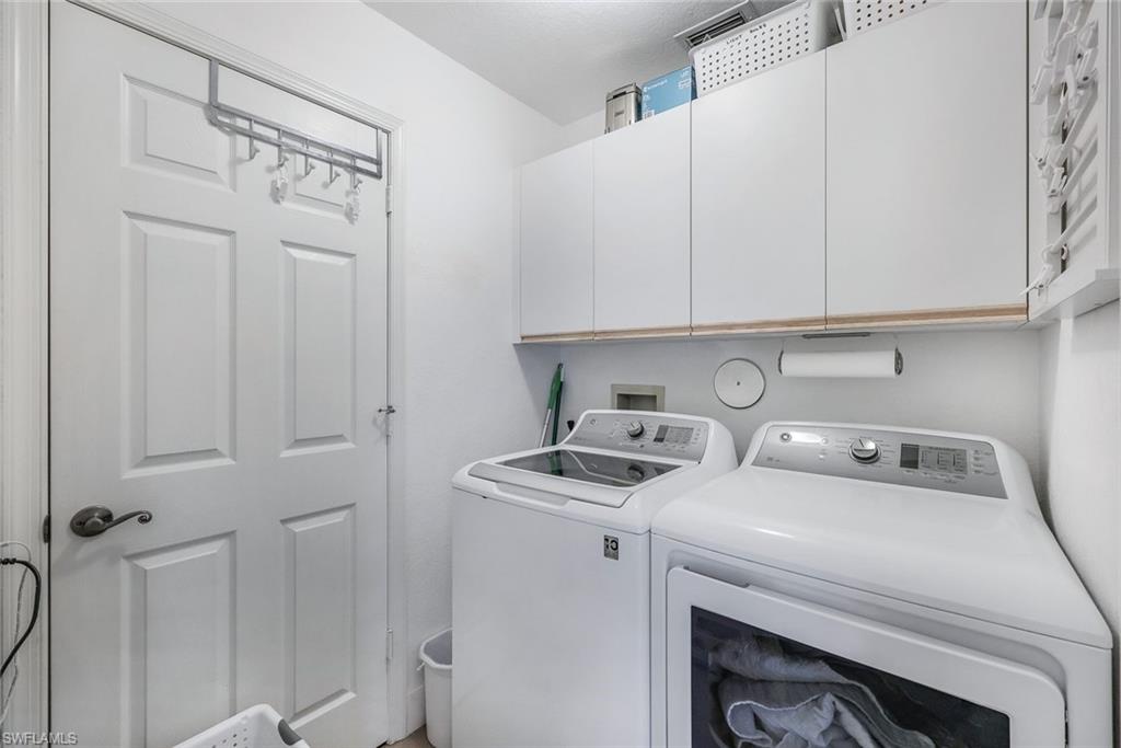 7108 Barrington Circle Naples, FL 34108 - Photo 20 of 25 a utility room with dryer and washer