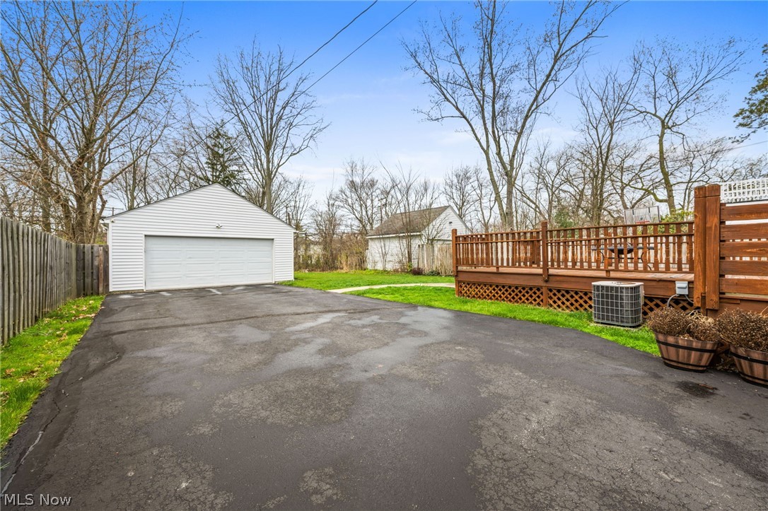 2368 Ashurst Road Cleveland, OH 44118 - Photo 19 of 20 Garage featuring central AC unit and a yard