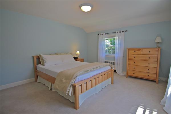 552 South Border Road Winchester, MA 01890 - Photo 15 of 19 a bedroom with a bed and a dresser