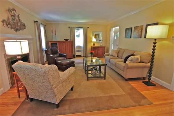 552 South Border Road Winchester, MA 01890 - Photo 6 of 19 a living room with furniture and a lamp